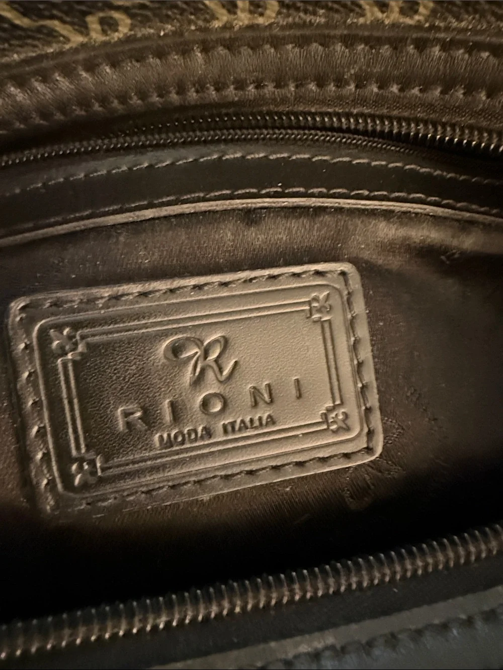 Rioni Signature Organizer Satchel featuring a black monogram 
